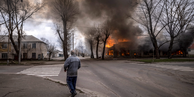 A man walks on a street in Severodonetsk, eastern Ukraine, following shelling 