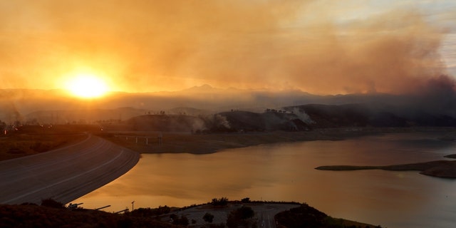 The Route Fire burns near the Castaic Lake reservoir, with a current water level of 48 percent of the historic average for today, amid ongoing drought on Aug. 31, 2022, near Castaic, California. 