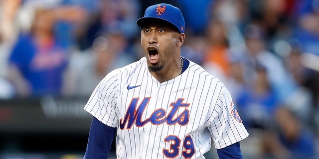 Edwin Diaz, #39 of the New York Mets, reacts after the eighth inning against the Los Angeles Dodgers at Citi Field on September 01, 2022, in New York City.