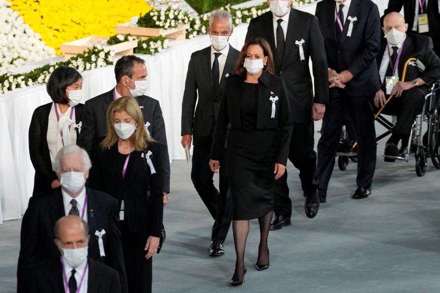 U.S. Vice President Kamala Harris, center, followed by U.S. Ambassador to Japan Rahm Emanuel attend the state funeral for Shinzo Abe on Sept. 27, 2022 in Tokyo.