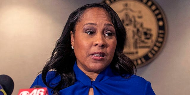 Fulton County District Attorney Fani Willis speaks during a press conference in the District Attorney's office at the Fulton County Courthouse in downtown Atlanta.