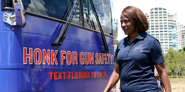 Rep. Val Demings, D-Fla., walks next to a bus at the kick off of the Giffords Florida bus tour, Thursday, Sept. 8, 2022, in Miami. Giffords Florida was launched by Giffords, the national gun violence prevention organization led by former Rep. Gabrielle Giffords of Arizona, in support of Florida candidates to end gun violence. Democrats in Florida are trying to make inroads firing up Latino voters on gun safety. Demings is running against Republican Senator Marco Rubio in the midterm elections. (AP Photo/Lynne Sladky)