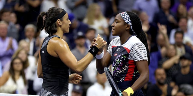 Caroline Garcia of France hugs Coco Gauff of the United States after their Women’s Singles Quarterfinal match on Day Nine of the 2022 US Open at USTA Billie Jean King National Tennis Center on September 06, 2022 in the Flushing neighborhood of the Queens borough of New York City.