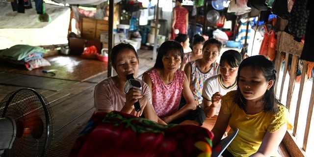 Karaoke is a popular form of entertainment in Vietnam, as seen in this 2019 photo of migrant workers singing karaoke in their downtime. 