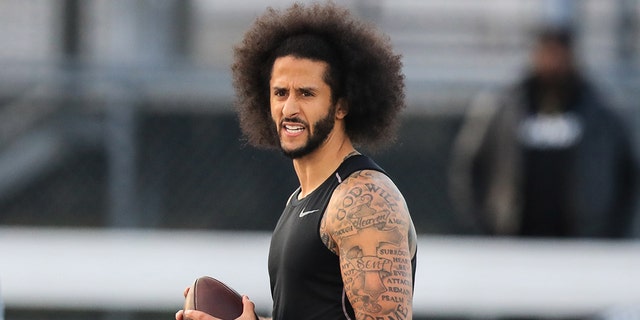 Colin Kaepernick looks to make a pass during a private NFL workout on Nov. 16, 2019, in Riverdale, Georgia.