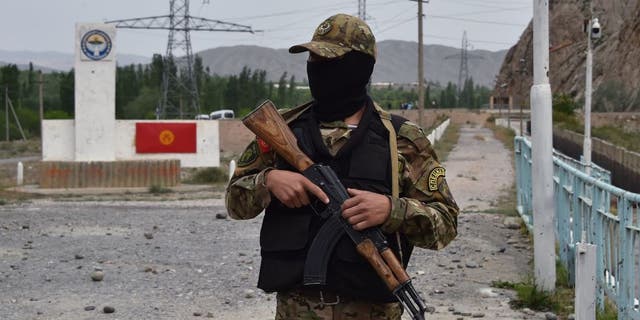 A Kyrgyz soldier guards the "Golovnoy" watershed in May 2001.