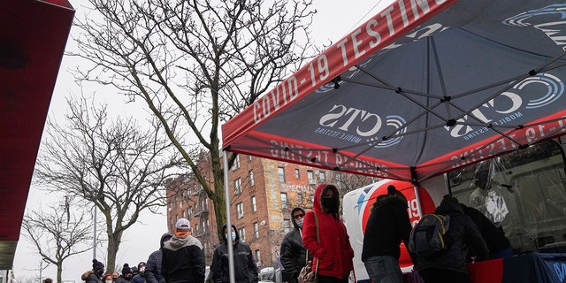 People wait for COVID-19 test in the Queens borough of New York on Dec. 29, 2021. 