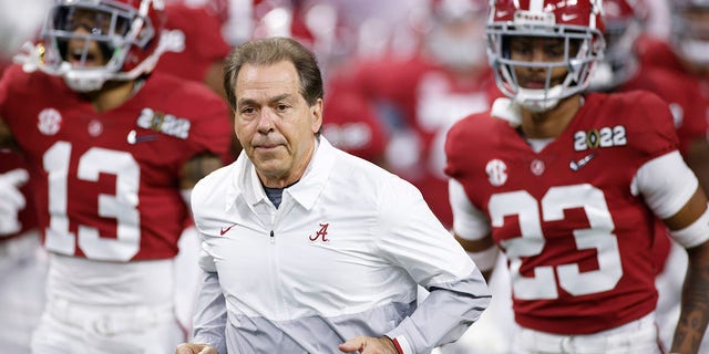 Alabama Crimson Tide head coach Nick Saban leads his team to the field prior to the CFP National Championship game against the Georgia Bulldogs at Lucas Oil Stadium in Indianapolis, Indiana, on Jan. 10, 2022.