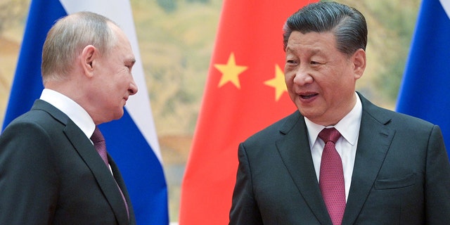 President Vladimir Putin and Chinese President Xi Jinping pose during a meeting at the Diaoyutai State Guesthouse on Feb. 4, 2022.