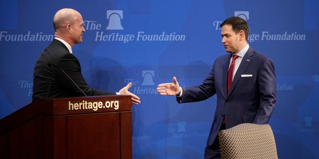 President of the Heritage Foundation Dr. Kevin Roberts shakes hands with Sen. Marco Rubio 