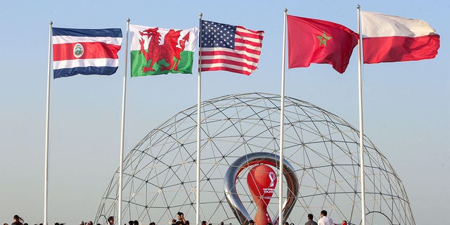 The flags of Costa Rica, Wales, United States, Morocco and Poland, nations which qualified for the 2022 World Cup, are shown in Doha, Qatar, during a flag-raising ceremony of the last remaining countries to qualify on June 16, 2022.