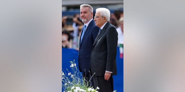 Sergio Mattarella, right, president of Italy, and Lorenzo Guerini, minister of defense, are seen during the swearing-in ceremony of the Carabinieri cadets in Turin on July 23, 2022.