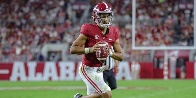 Bryce Young, #9 of the Alabama Crimson Tide, runs for a touchdown against the Utah State Aggies at Bryant Denny Stadium on September 3, 2022, in Tuscaloosa, Alabama. 