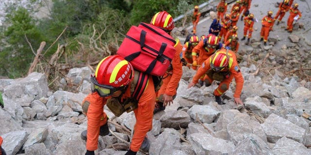 Rescuers search and evacuate injured people in Luding county, Ganzi prefecture, Southwest China's Sichuan province, Sept. 6, 2022. 