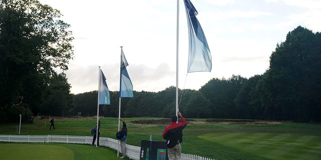 Flags are removed as a mark of respect after play is suspended following the announcement of the death of Queen Elizabeth II during the BMW PGA Championship at Wentworth Golf Club, Virginia Water, Thursday, Sept. 8, 2022. 