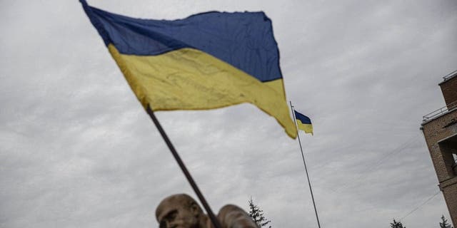 Ukrainian flag waves after Ukrainian army liberated the town of Balakliya in the southeastern Kharkiv oblast on Sept. 11, 2022. 