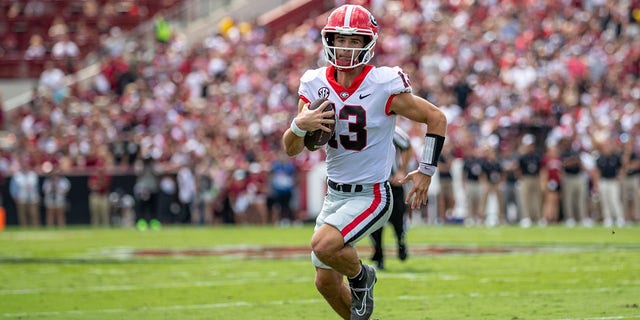 Georgia Bulldogs quarterback Stetson Bennett (13) scrambles for a first down during a game against the South Carolina Gamecocks Sept. 17, 2022, at Williams-Brice Stadium in Columbia, SC. 