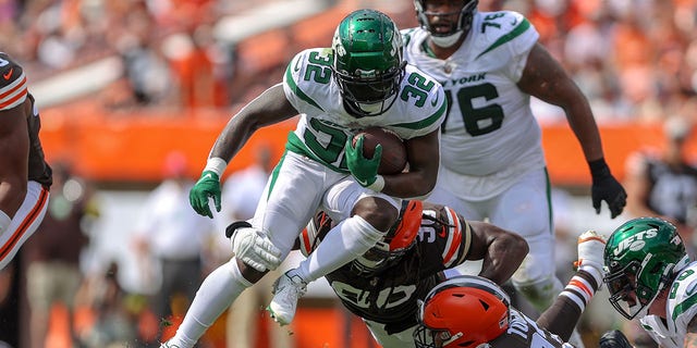 New York Jets running back Michael Carter carries the football during the Browns game on Sept. 18, 2022, at FirstEnergy Stadium in Cleveland.