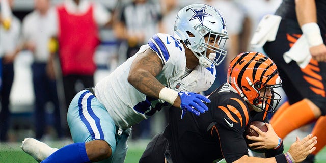 Micah Parsons of the Dallas Cowboys, left, sacks Joe Burrow of the Cincinnati Bengals in Arlington, Texas, on Sept. 18, 2022.