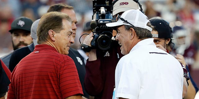 Head coach Nick Saban, of the Alabama Crimson Tide, meets with head coach Jimbo Fisher, of the Texas A&amp;M Aggies, at Kyle Field on Oct. 9, 2021 in College Station, Texas. 