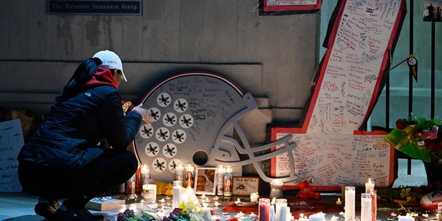 A vigil is held at Ohio Stadium in Columbus, Ohio, in memory of former Ohio State Buckeye Dwayne Haskins on April 12, 2022.