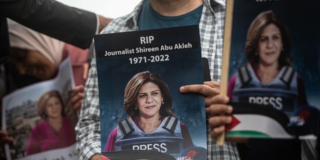 Tributes are paid to murdered Palestinian journalist Shireen Abu Akleh at a protest and vigil at BBC Broadcasting House on May 12, 2022 in London. 