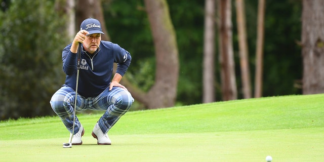 Ian Poulter of Majesticks GC lines up a putt on the second green at the LIV Golf Invitational — London at The Centurion Club June 9, 2022, in St Albans, England. 