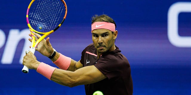 Rafael Nadal, of Spain, hits a backhand against Fabio Fognini, of Italy, in the second round of the men's singles at the US Open at the USTA Billie Jean King National Tennis Center on September 01, 2022 in New York City. 