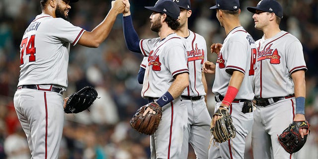 Kenley Jansen (74) of the Atlanta Braves celebrates the final out with teammates against the Seattle Mariners to win 6-4 at T-Mobile Park Sept. 9, 2022, in Seattle. 