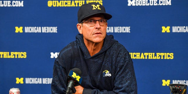 Michigan head coach Jim Harbaugh speaks to the press after the game against the Hawaii Rainbow Warriors at Michigan Stadium in Ann Arbor, Michigan, on Saturday.