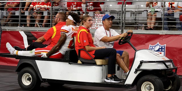 Cornerback Trent McDuffie, #21 of the Kansas City Chiefs, is carted off the field during the third quarter of the game against the Arizona Cardinals at State Farm Stadium on Sept. 11, 2022, in Glendale, Arizona. 