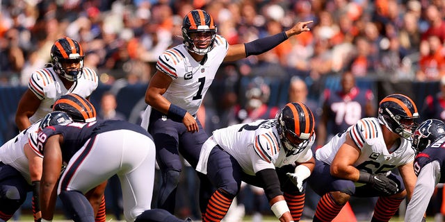 Justin Fields of the Chicago Bears directs the offense against the Houston Texans during the first quarter at Soldier Field in Chicago on Sept. 25, 2022.