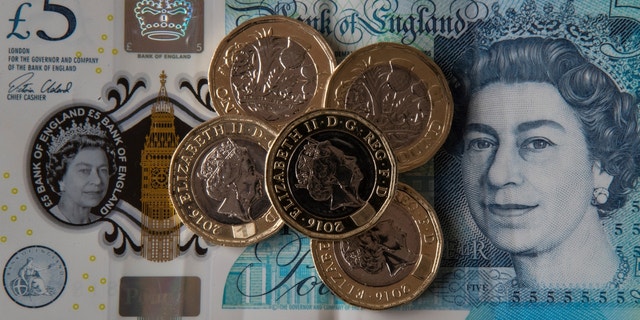 Queen Elizabeth's likeness on Bank of England notes and coins.