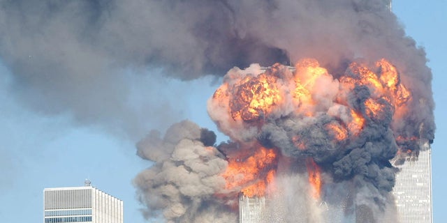 A fiery blasts rocks the World Trade Center after being hit by two planes September 11, 2001 in New York City. 