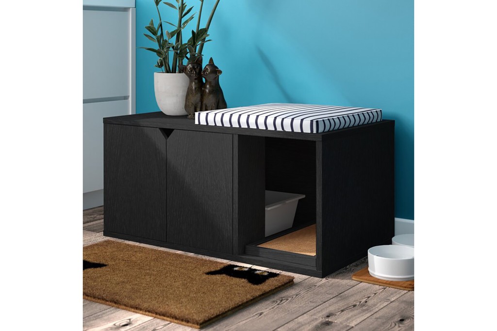 A black bench and litter box enclosure 