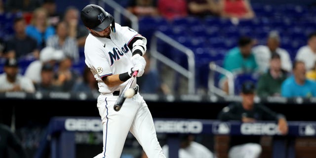 Jordan Groshans #65 of the Miami Marlins hits a home run against the Philadelphia Phillies during the third inning at loanDepot park on September 15, 2022 in Miami, Florida. 