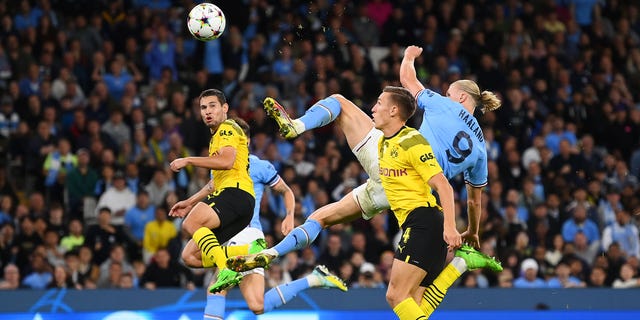 Erling Haaland of Manchester City scores against Dortmund at Etihad Stadium in Manchester, England, on Sept. 14, 2022.