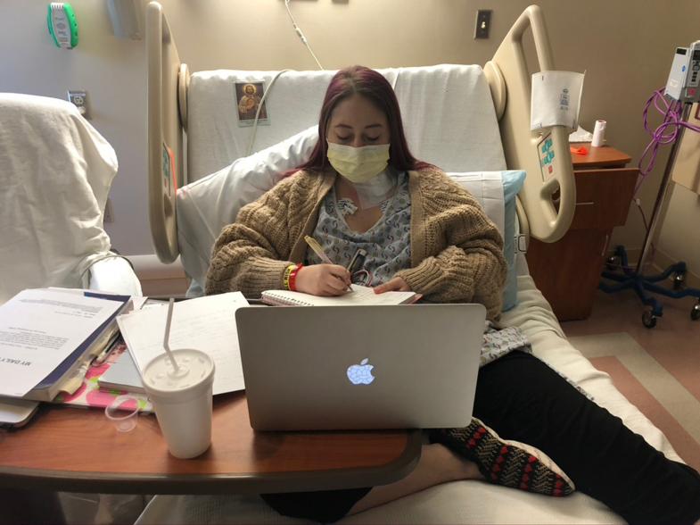 Gianna doing homework in her hospital bed after organ rejection and in heart failure at the University of Pittsburgh Medical Center in 2020