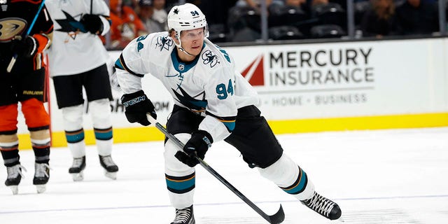 FILE - San Jose Sharks forward Alexander Barabanov, of Russia, controls the puck against the Anaheim Ducks during the first period of an NHL hockey game Sunday, Sept. 26, 2021, in Anaheim, Calif. Russian players on two NHL teams opening the season in the Czech Republic will be allowed to participate in the two Global Series games in Prague after all. Deputy Commissioner Bill Daly on Thursday, Sept. 29, 2022, confirmed to The Associated Press that the Czech government has dropped its attempted ban of Russian players for San Jose and Nashville.