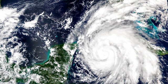 This Sept. 26, 2022, satellite image released by NASA shows Hurricane Ian growing stronger as it barreled toward Cuba.