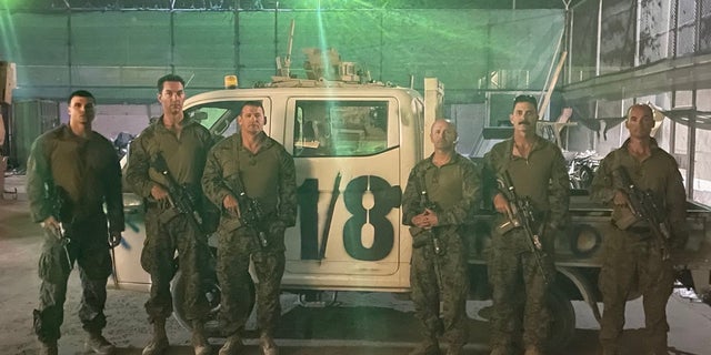 Retired Marine gunner William Callen stands alongside fellow soldiers the morning before departure from the Hamid Karzai International Airport in August 2021.