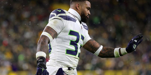 Jamal Adams #33 of the Seattle Seahawks waits for a timeout during a game against the Green Bay Packers at Lambeau Field on November 14, 2021 in Green Bay, Wisconsin.  The Packers defeated the Seahawks 17-0. 