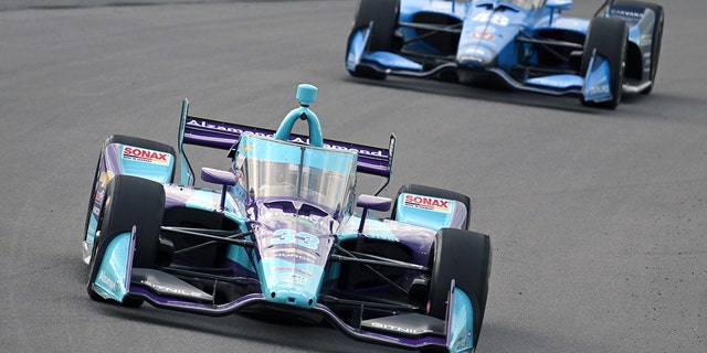 Ed Carpenter runs ahead of Jimmie Johnson, #48 Chip Ganassi Racing Honda, during the NTT IndyCar Series Bommarito Automotive Group 500, Aug. 20, 2022 at World Wide Technology Raceway, Madison, Illinois.