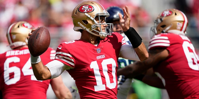 San Francisco 49ers quarterback Jimmy Garoppolo (10) passes against the Seattle Seahawks during the first half of a game in Santa Clara, Calif., Sunday, Sept. 18, 2022. 