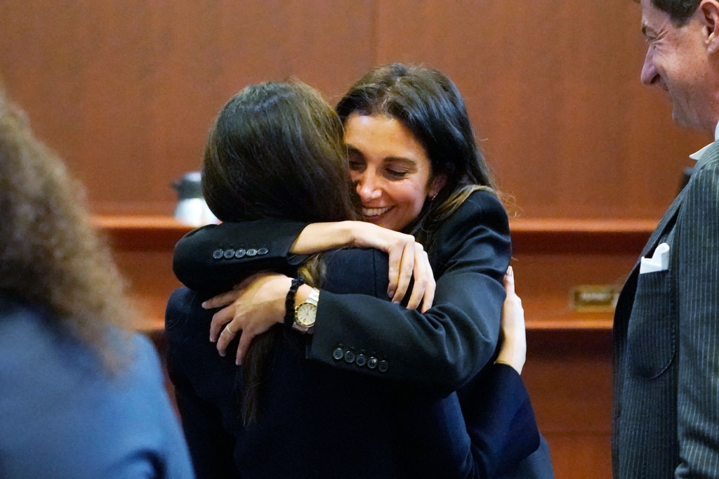 Attorney Joelle Rich hugs attorney Camille Vasquez during Johnny Depp’s defamation trial in Fairfax, Virginia on May 16, 2022.