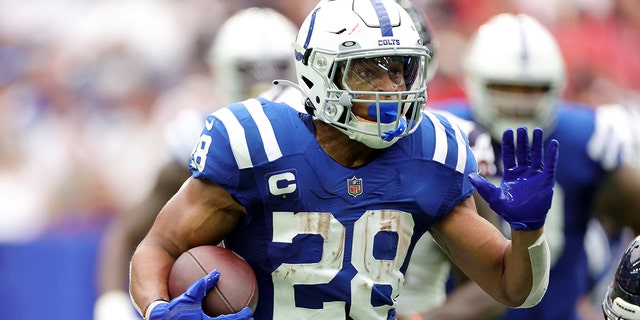 Jonathan Taylor of the Indianapolis Colts carries the ball against the Houston Texans at NRG Stadium in Houston on Sept. 11, 2022.