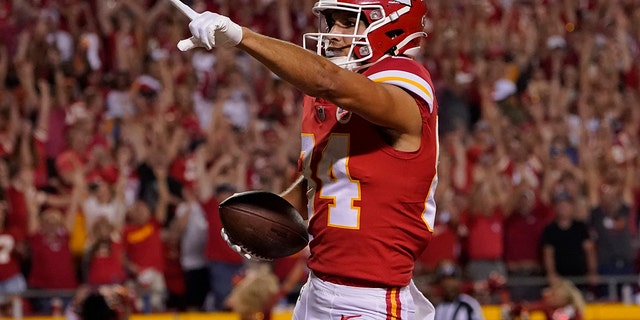 Kansas City Chiefs wide receiver Justin Watson celebrates after scoring during the second half of an NFL football game against the Los Angeles Chargers Thursday, Sept. 15, 2022, in Kansas City, Mo.