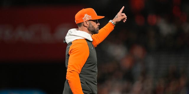 Manager Gabe Kapler of the San Francisco Giants signals to the bullpen to make a pitching change during the game against the Atlanta Braves at Oracle Park on Sept. 13, 2022, in San Francisco.