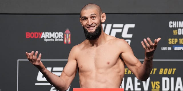 Khamzat Chimaev of Russia poses on a scale during the UFC 279 official weigh-in at UFC APEX Sept. 9, 2022, in Las Vegas.