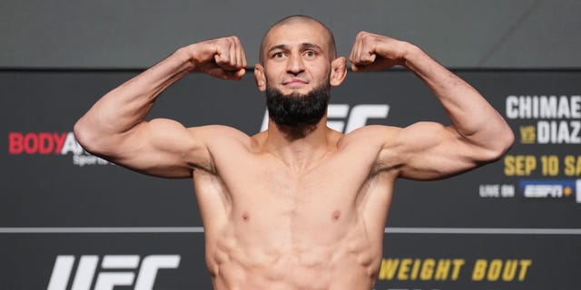 Khamzat Chimaev of Russia poses on a scale during the UFC 279 official weigh-in at UFC APEX Sept. 9, 2022, in Las Vegas.